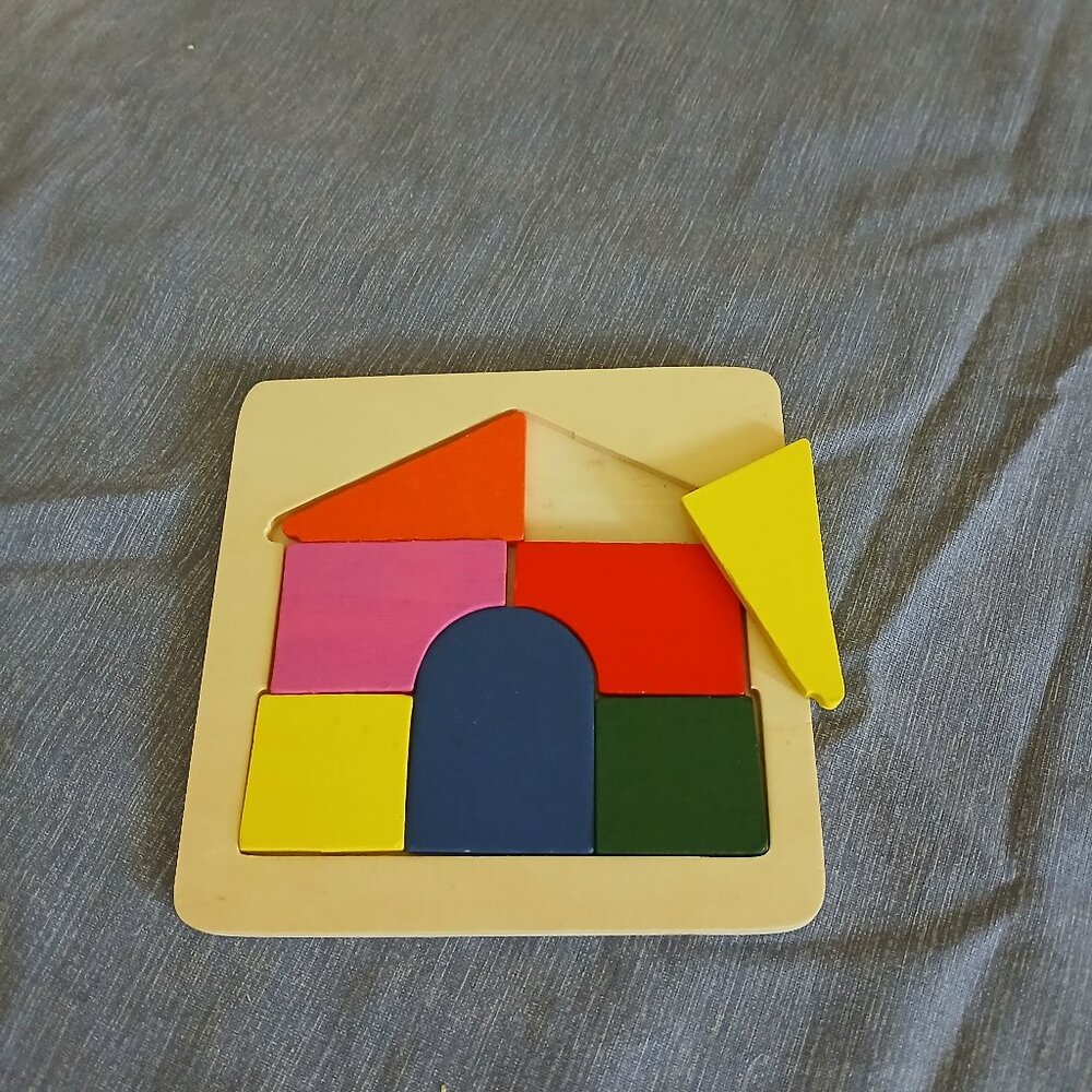 Wooden house puzzle 7 pieces used